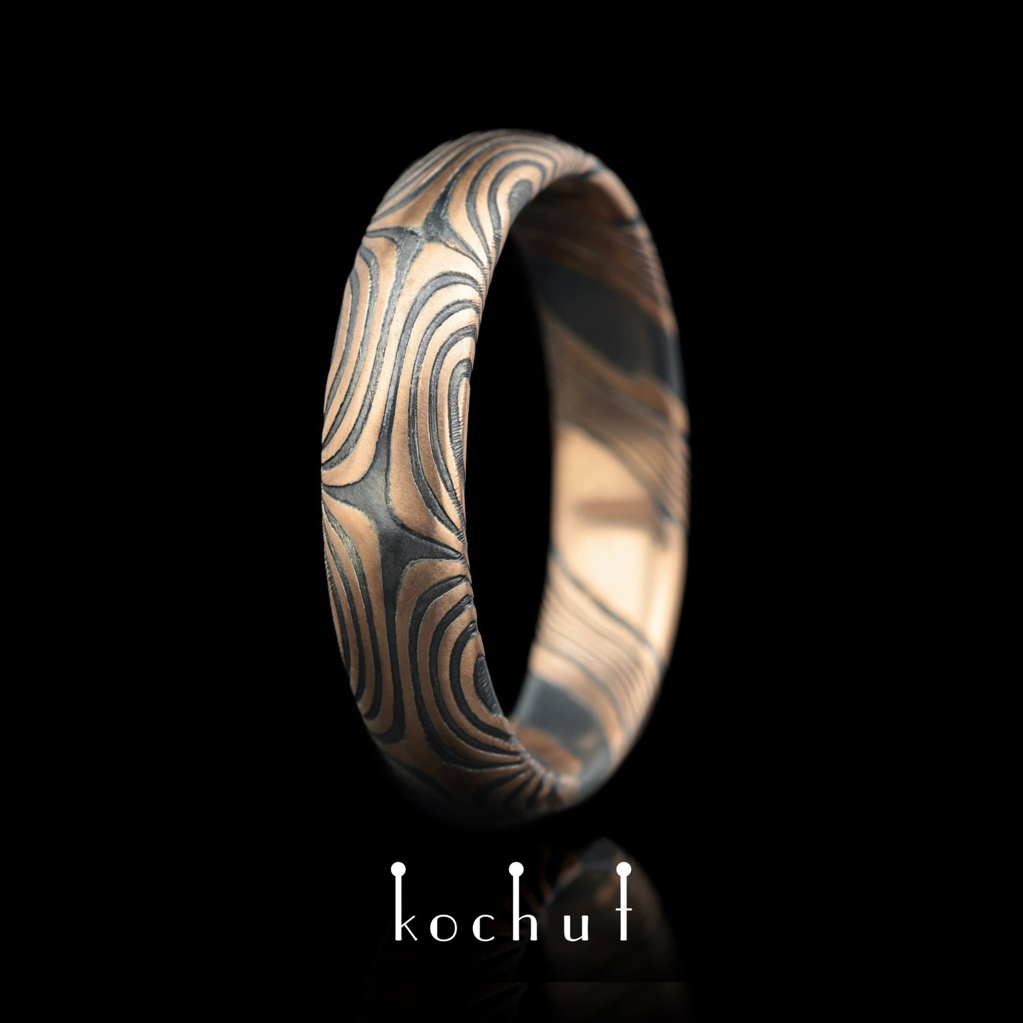 Orion — Mokume-Ehering aus Rotgold, graviert und oxidiertes Silber