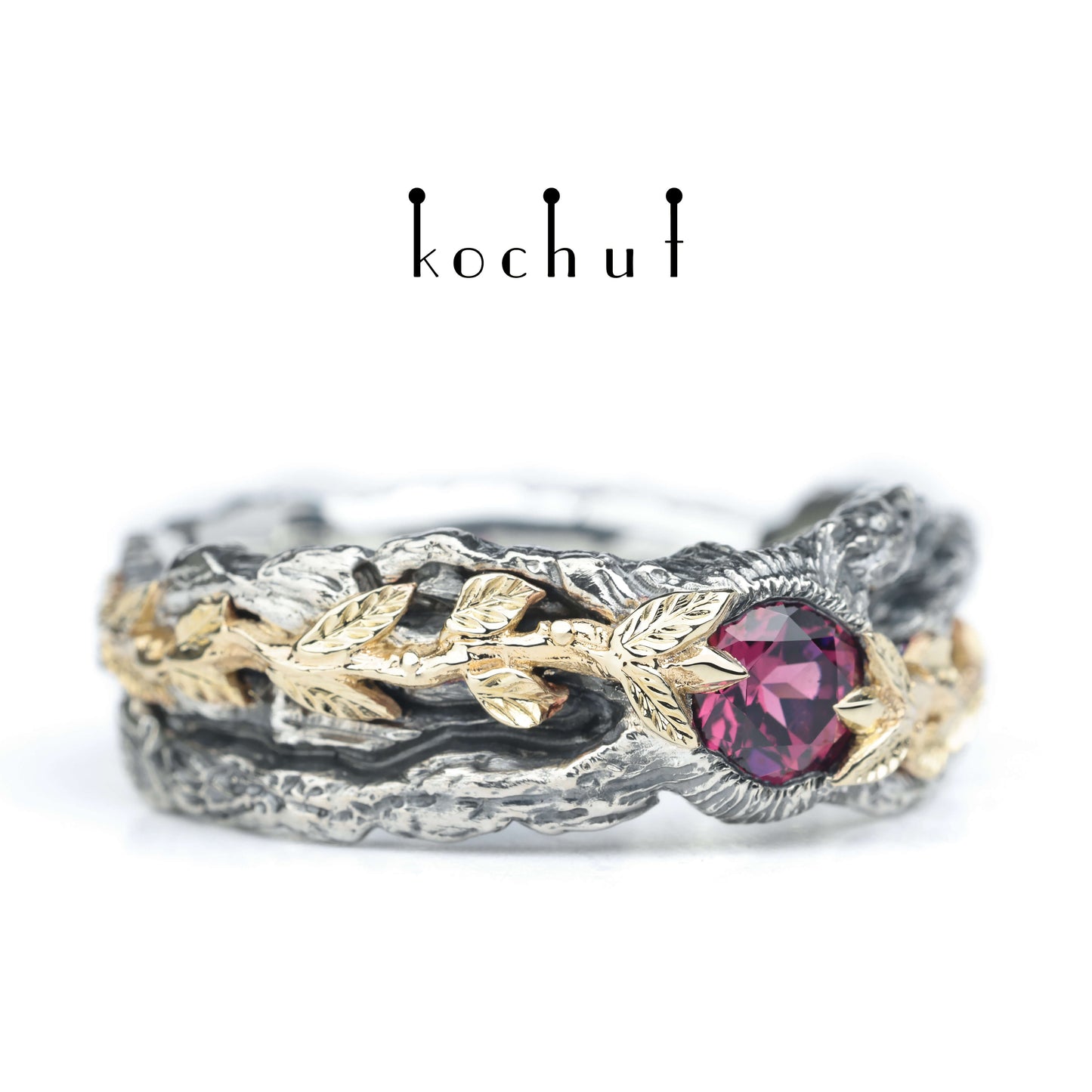 Kraft des Lebens — Ring aus oxidiertem Silber und Gelbgold mit Granat