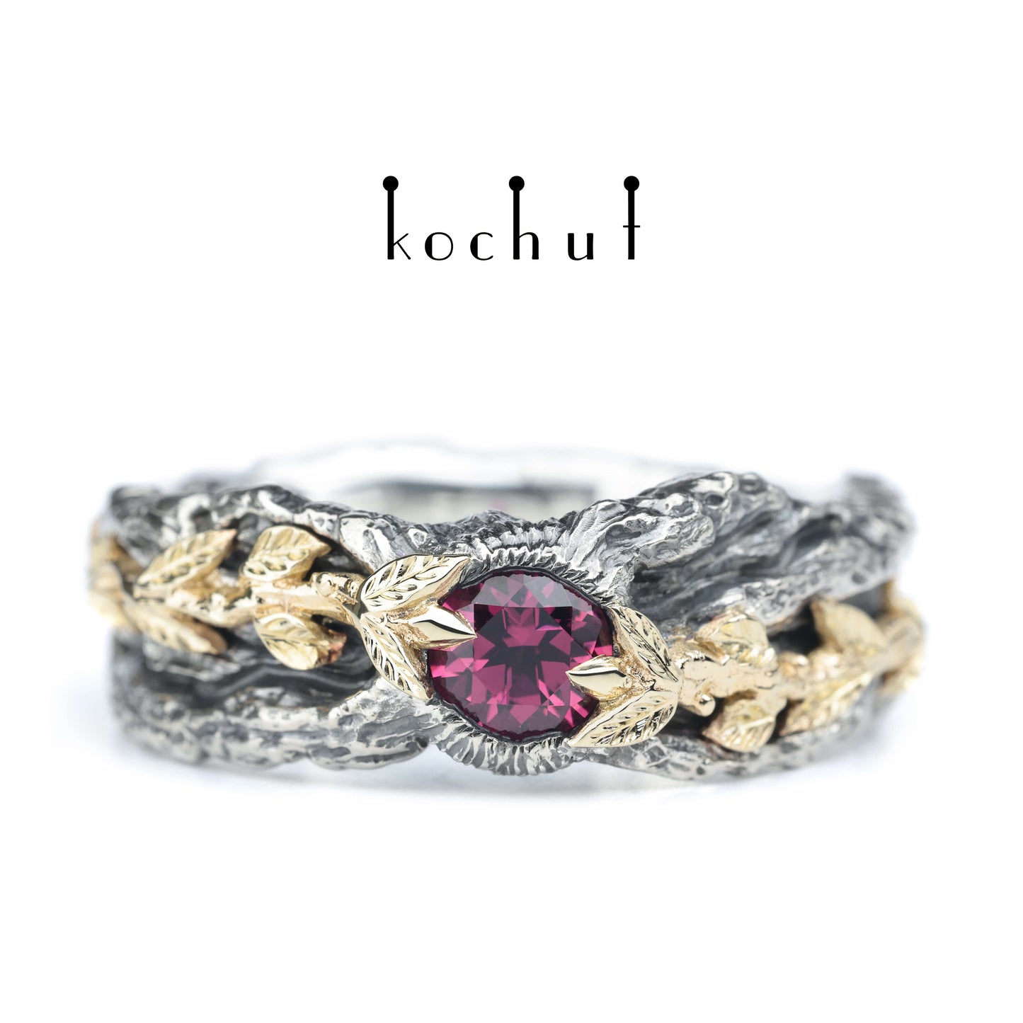 Kraft des Lebens — Ring aus oxidiertem Silber und Gelbgold mit Granat