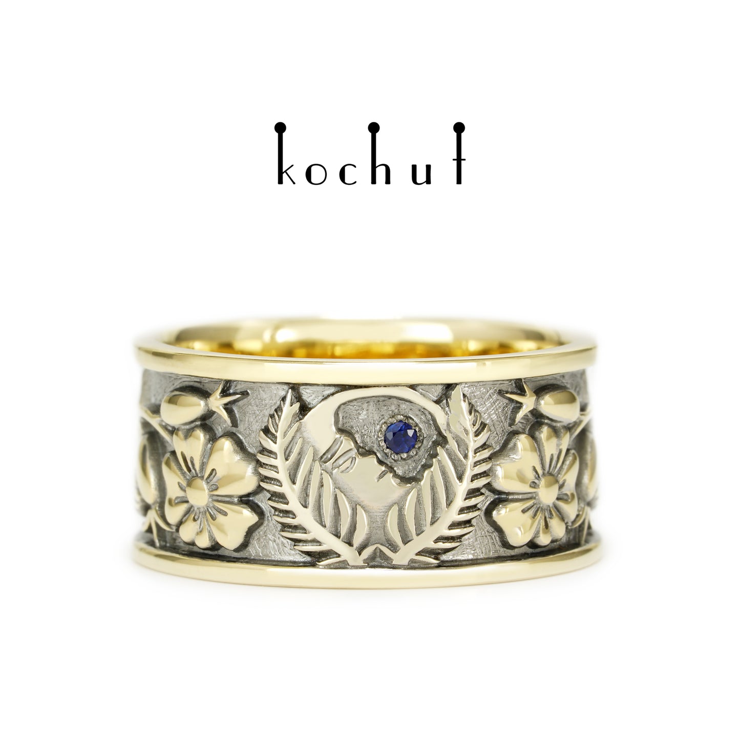 Alchemie der Liebe — Ehering aus Gelb- und Weißgold mit einem Saphir, überzogen mit schwarzem Rhodium