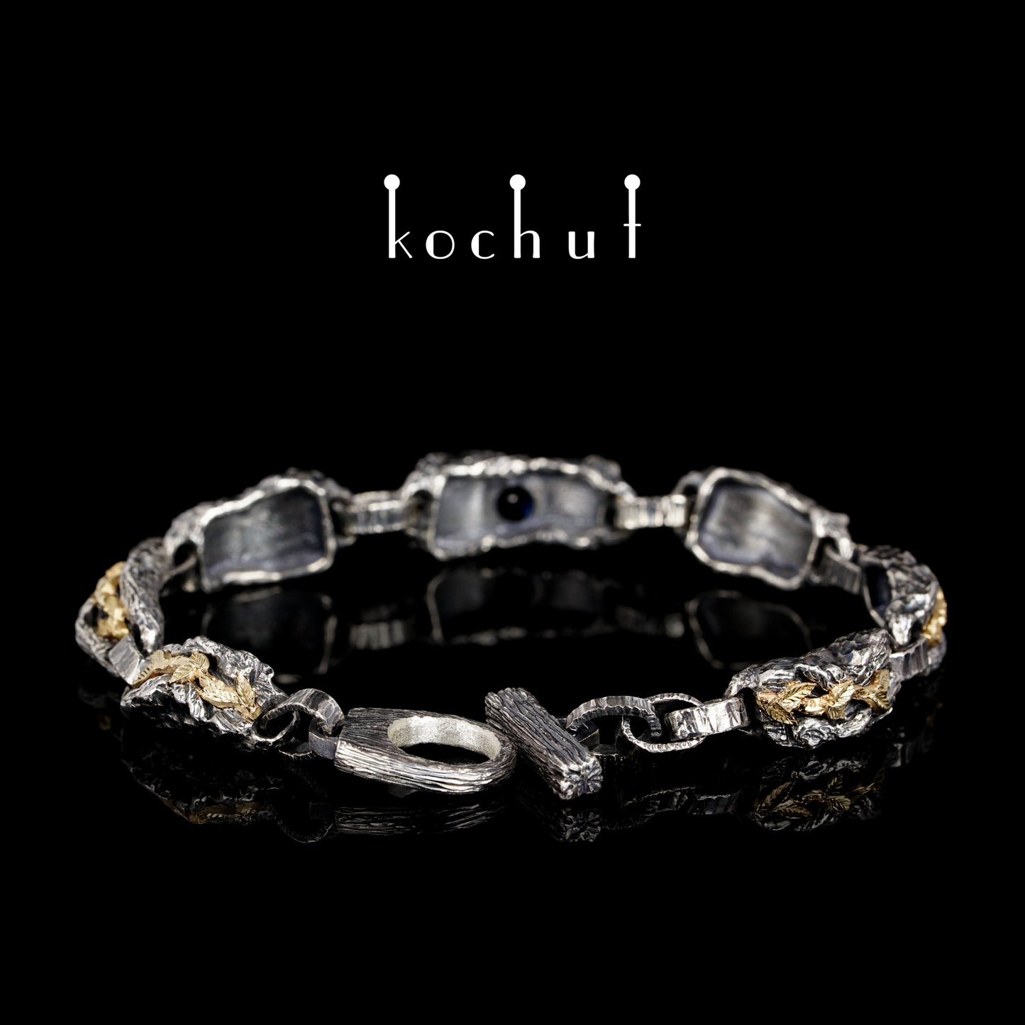 Kraft des Lebens — Armband aus oxidiertem Silber und Gelbgold mit Saphir