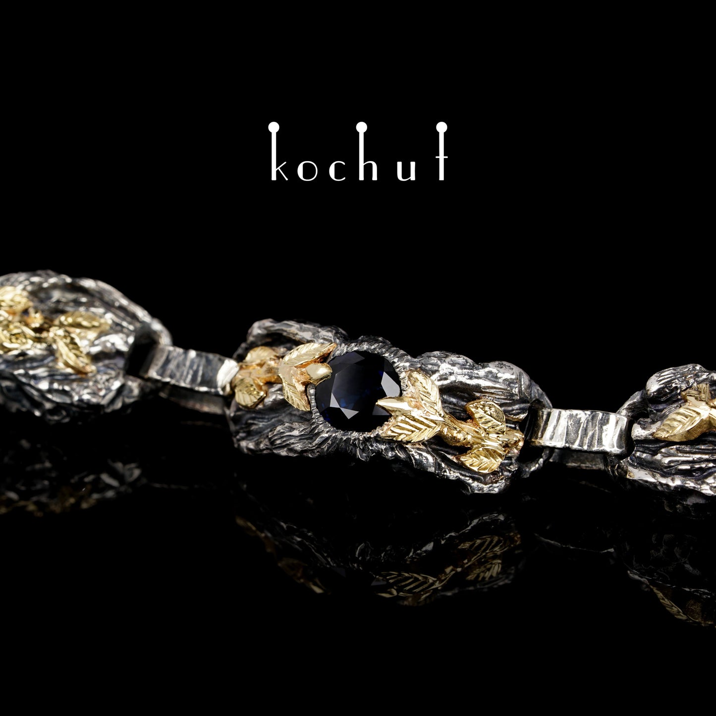 Kraft des Lebens — Armband aus oxidiertem Silber und Gelbgold mit Saphir