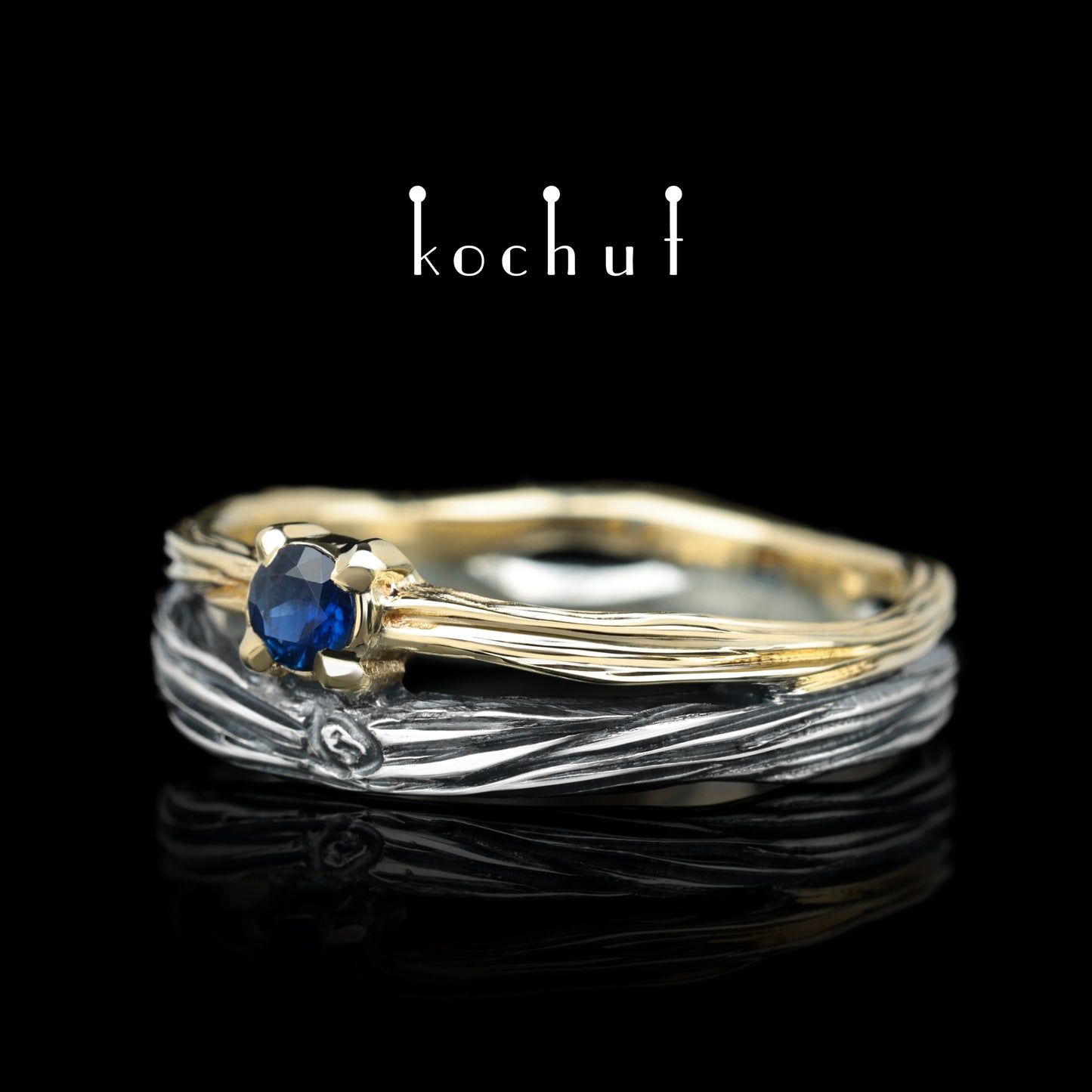 Auge des Waldes — Ehering aus oxidiertem Silber und Gelbgold mit Saphir