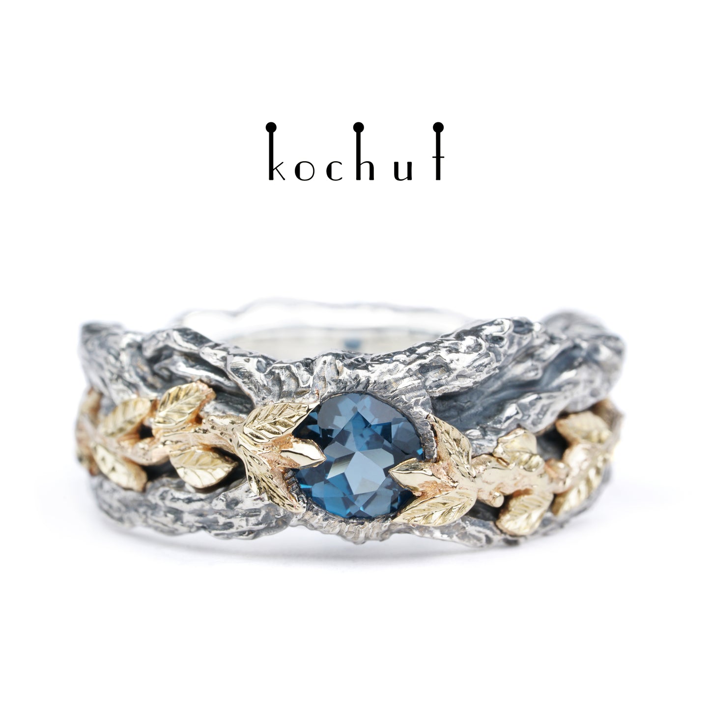 Kraft des Lebens — Ring aus oxidiertem Silber und Gelbgold mit Topas