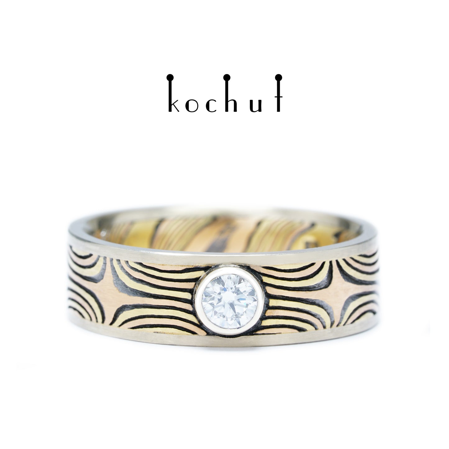 Das Leuchten der östlichen Sterne — Mokume-Ring aus Gelb-, Rotgold sowie graviertem und oxidiertem Silber mit Weißgoldfassungen, besetzt mit einem Diamanten
