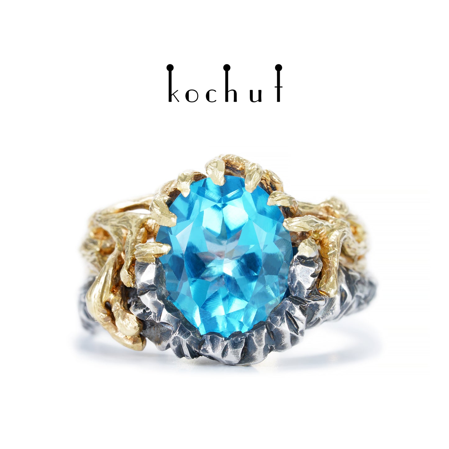 Dominant — ein Ring aus oxidiertem Silber und Gelbgold mit Topas