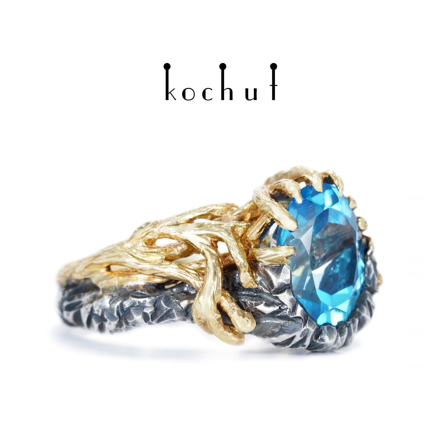 Dominant — ein Ring aus oxidiertem Silber und Gelbgold mit Topas