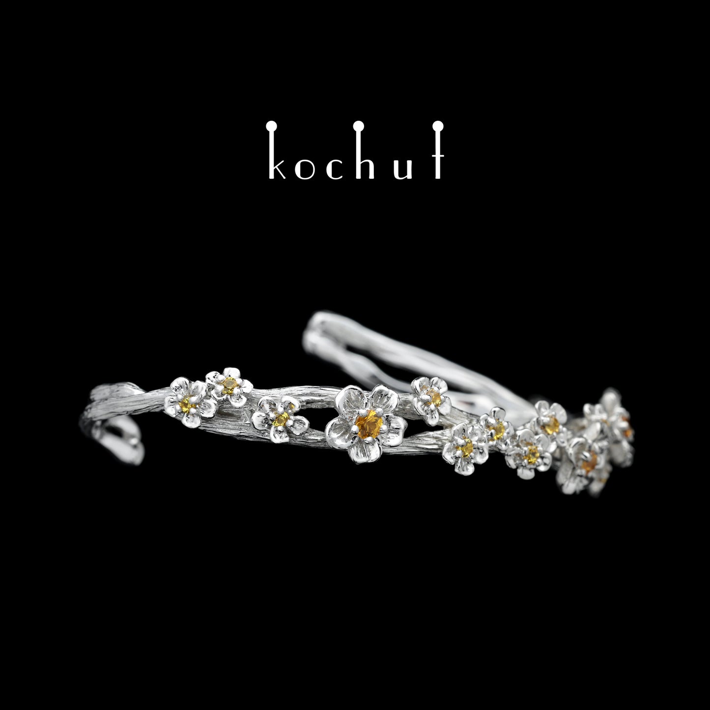 Blumenkrone — ein silbernes Armband mit Weißrhodium-Beschichtung und Saphiren