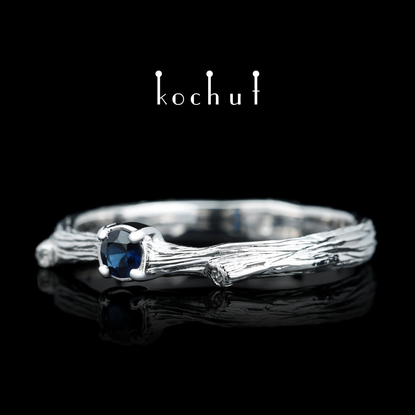 Zartes Zweig — silberner Ring mit einem Saphir, beschichtet mit WeißgoldrhODIUM