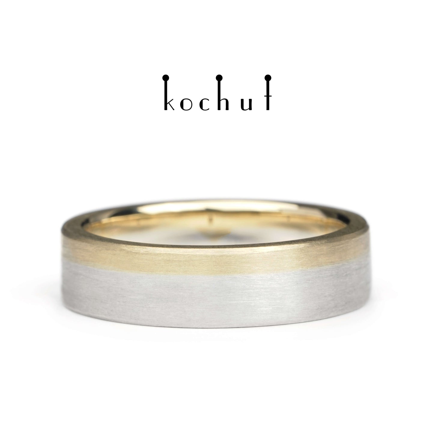Die letzte Grenze – flach geformter Ehering aus Gelbgold und Sterlingsilber