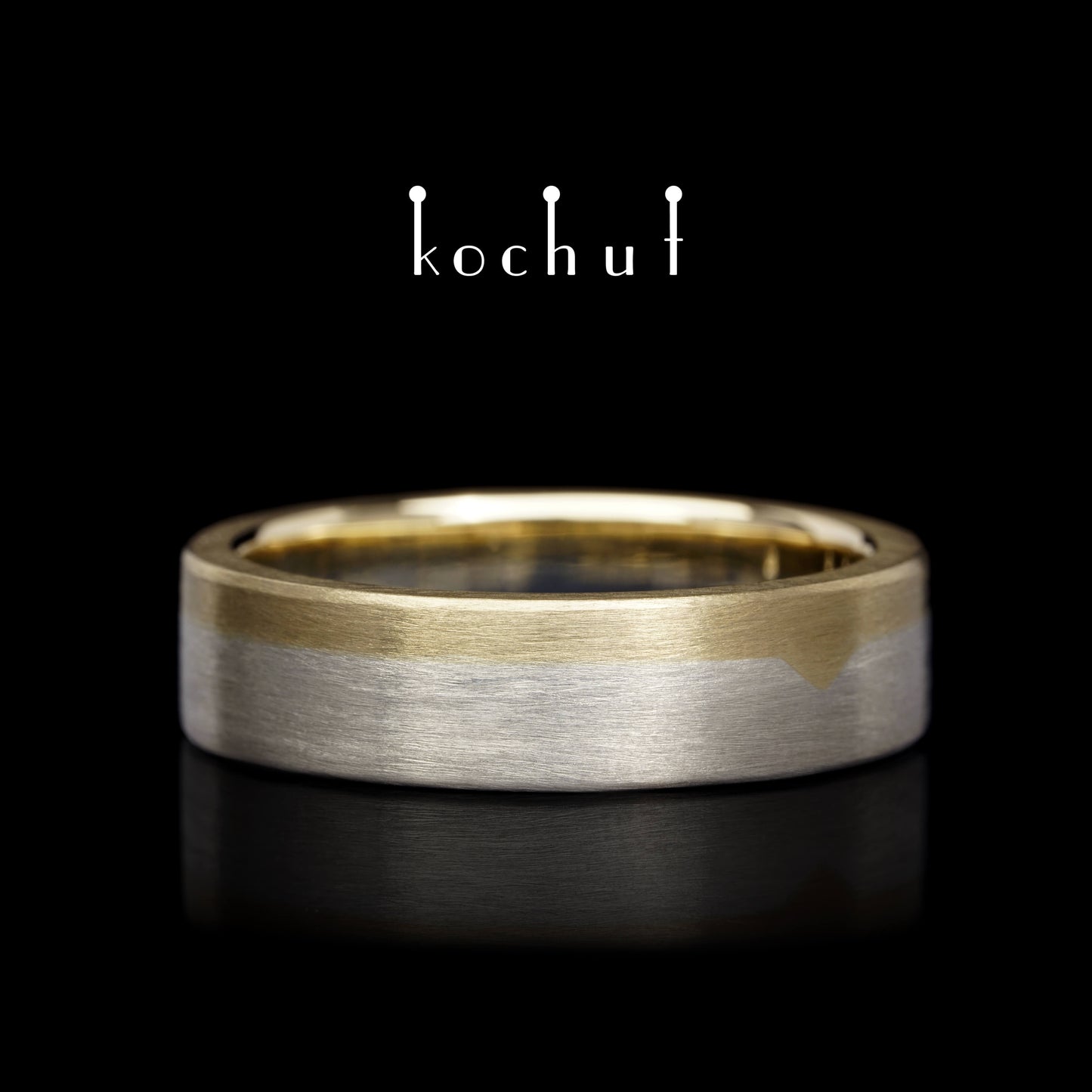 Die letzte Grenze – flach geformter Ehering aus Gelbgold und Sterlingsilber