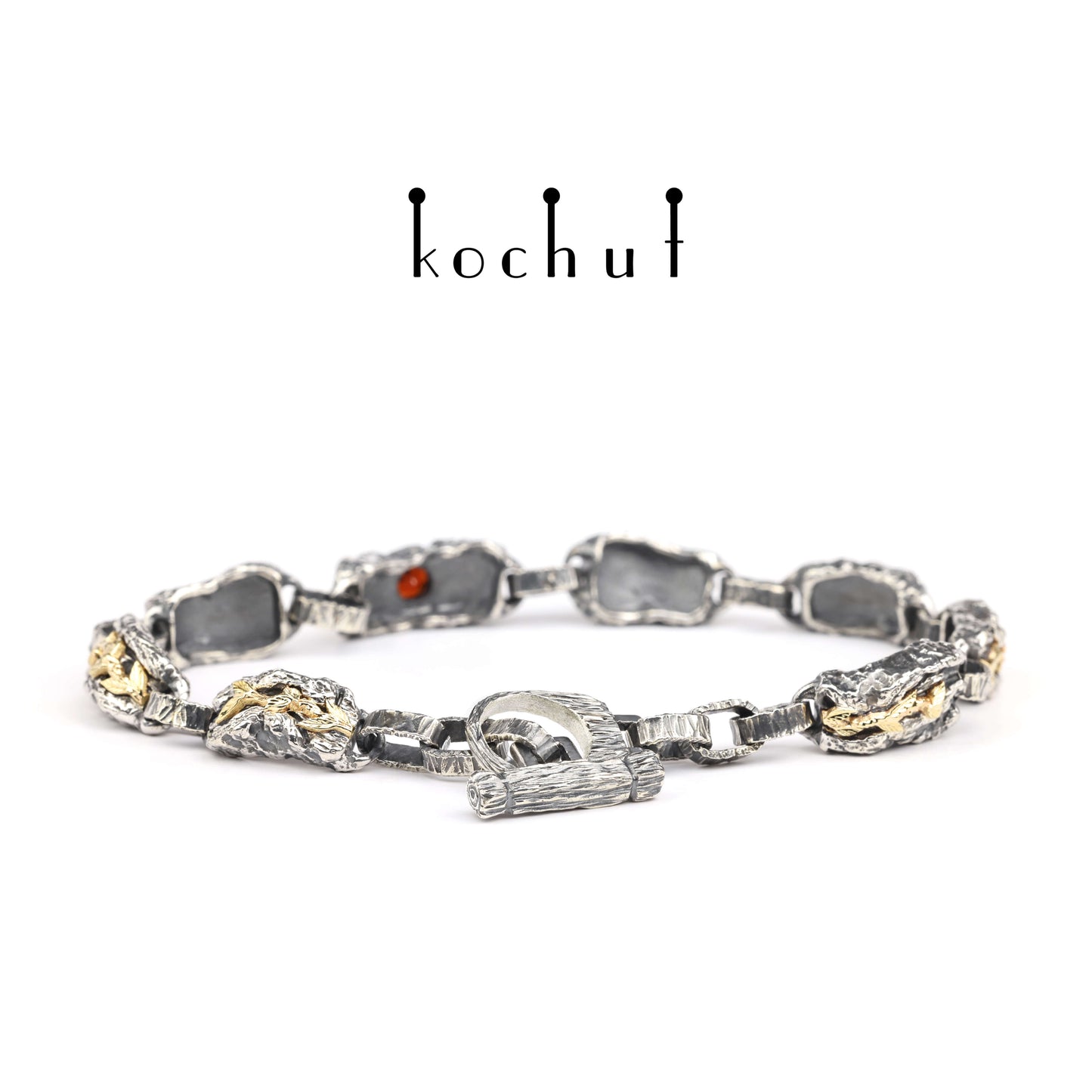 Kraft des Lebens — Armband aus oxidiertem Silber und Gelbgold mit Granat