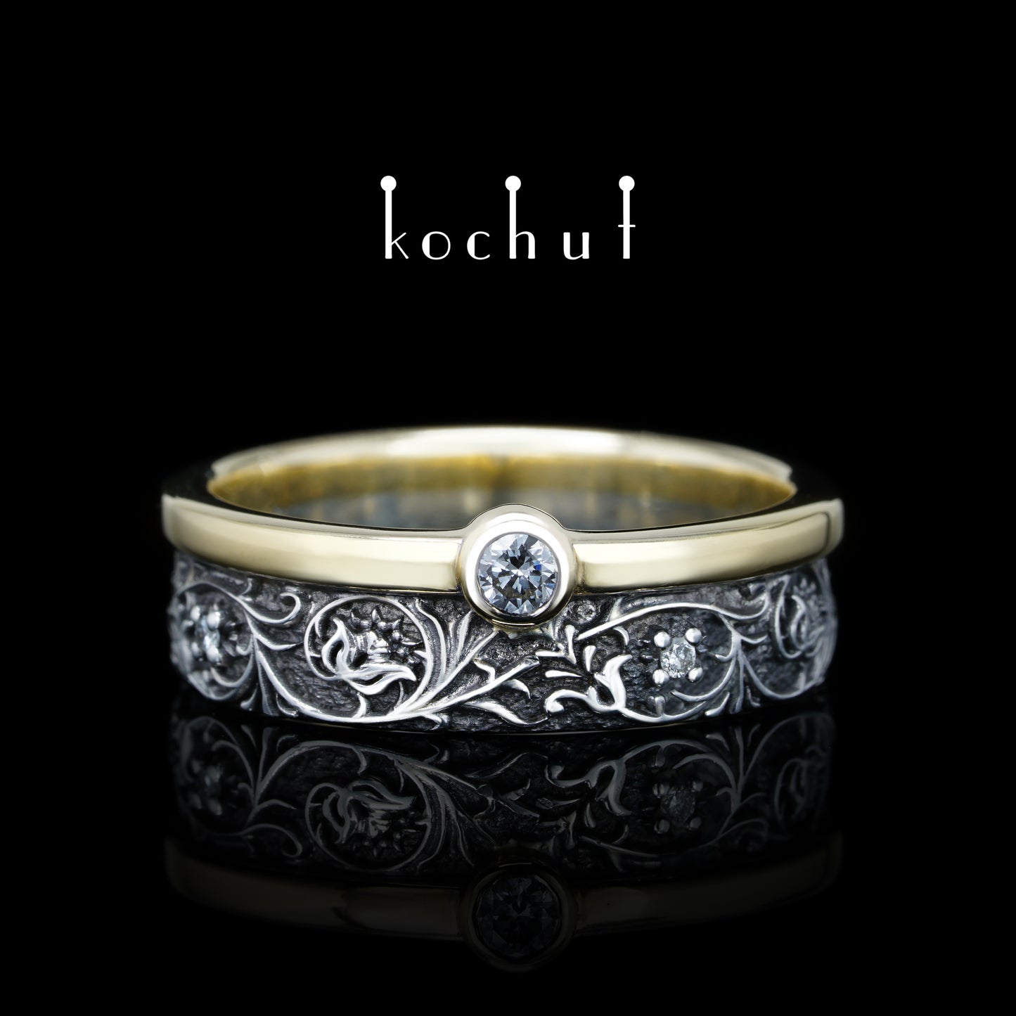 Harmonie der Natur — ein Ring aus Silber und Gelbgold mit Diamanten, überzogen mit schwarzem Rhodium