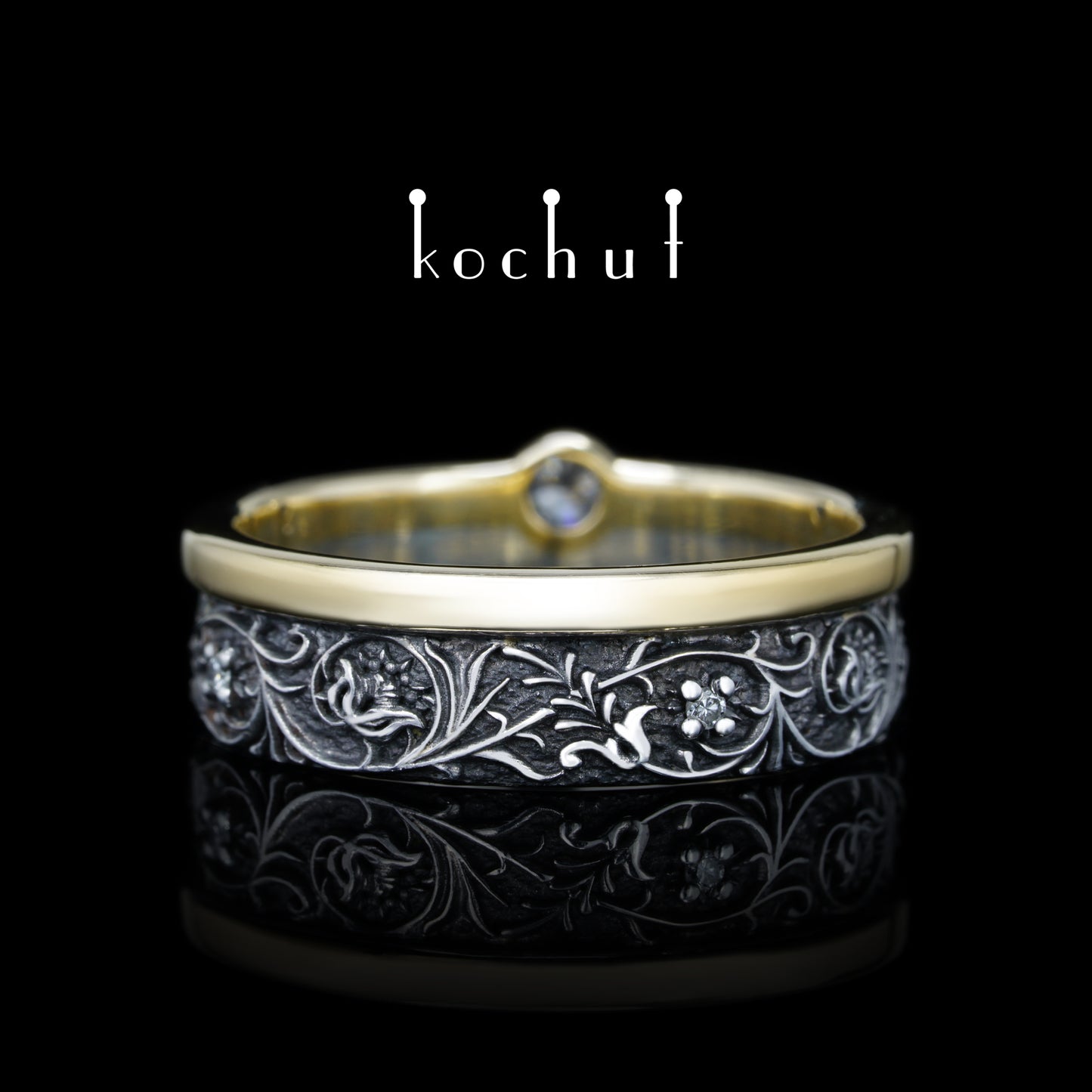 Harmonie der Natur — ein Ring aus Silber und Gelbgold mit Diamanten, überzogen mit schwarzem Rhodium