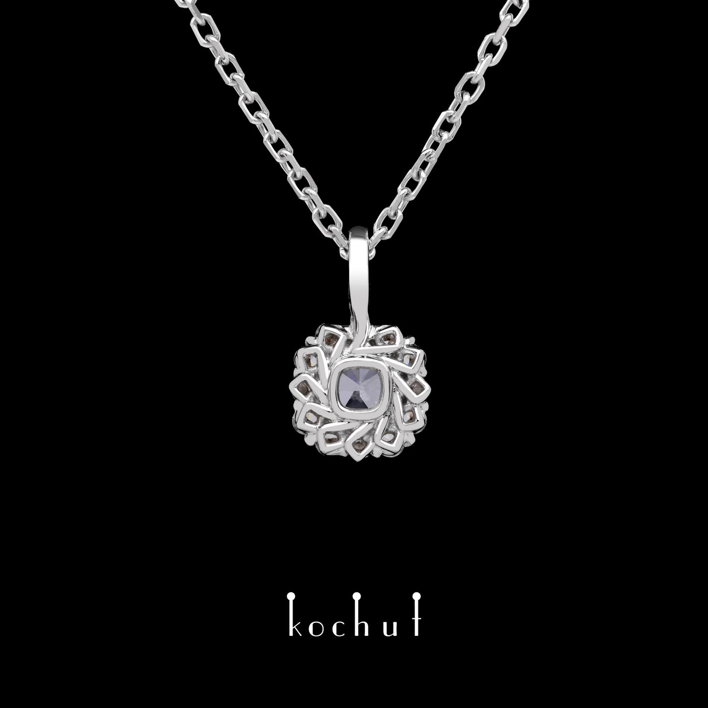 Zeitlos — Anhänger aus Weißgold mit einem blauen Diamanten und einer Streuung weißer Diamanten, beschichtet mit weißem Rhodium