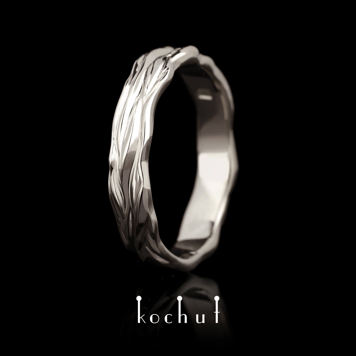Wellen der Liebe — Ehering aus Palladium-Gold
