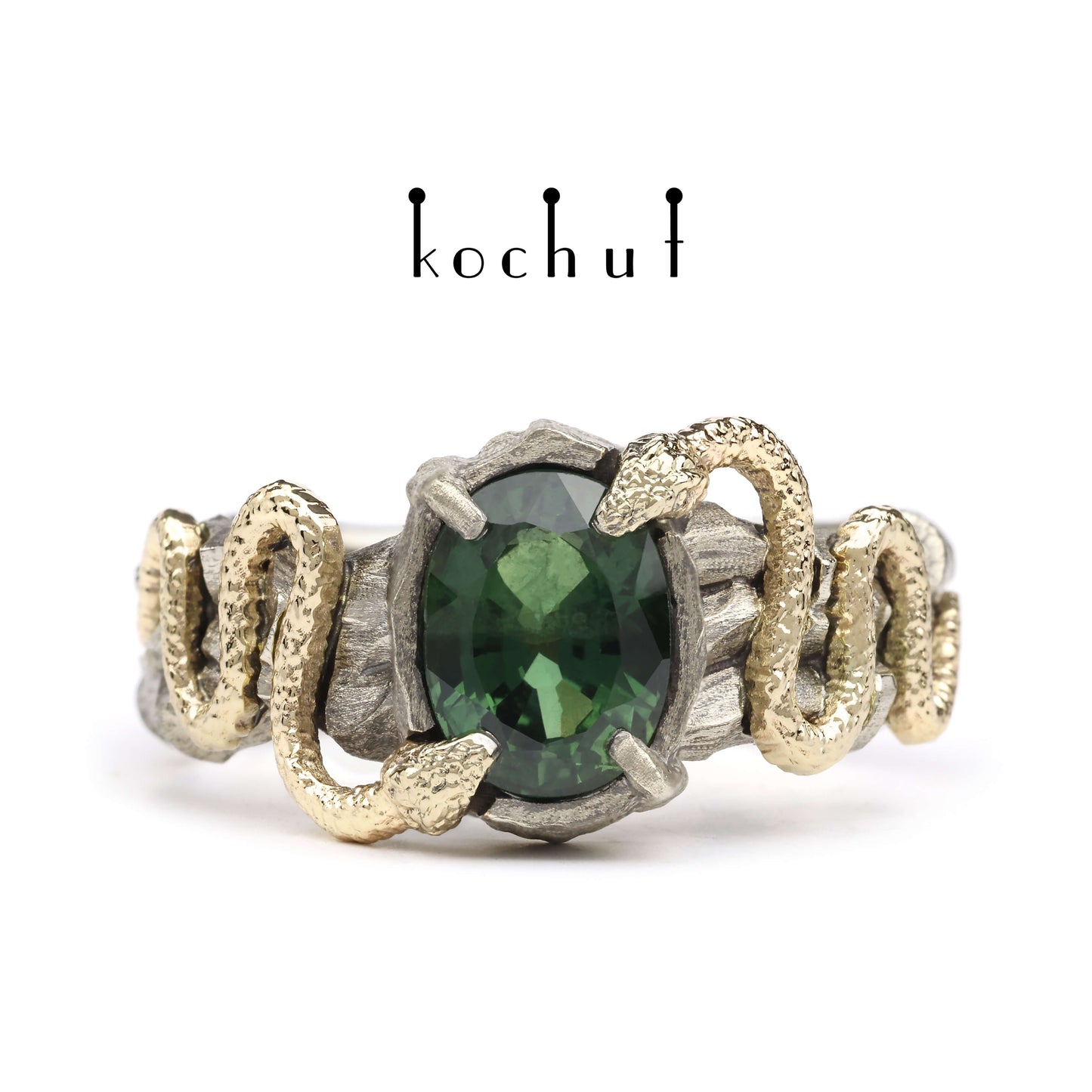Verlockung — Ring aus Weiß- und Gelbgold mit grünem Saphir, überzogen mit schwarzem Rhodium