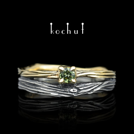 Auge des Waldes — Ehering aus oxidiertem Silber und Gelbgold mit Chrysolith