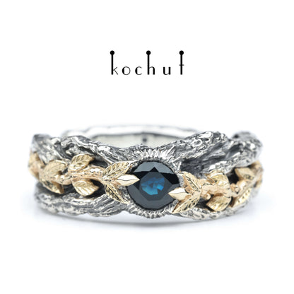 Kraft des Lebens — Ring aus oxidiertem Silber und Gelbgold mit Saphir