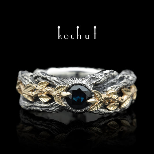 Kraft des Lebens — Ring aus oxidiertem Silber und Gelbgold mit Saphir