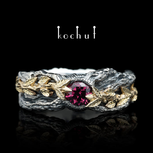 Kraft des Lebens — Ring aus oxidiertem Silber und Gelbgold mit Granat