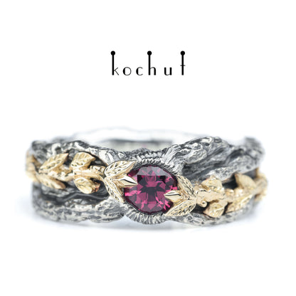 Kraft des Lebens — Ring aus oxidiertem Silber und Gelbgold mit Granat
