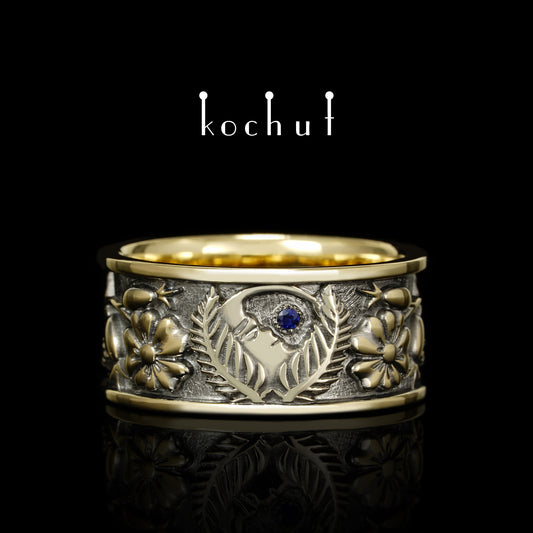 Alchemie der Liebe — Ehering aus Gelb- und Weißgold mit einem Saphir, überzogen mit schwarzem Rhodium
