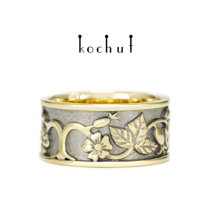 Alchemie der Liebe — Ehering aus Gelb- und Weißgold mit einem Saphir, überzogen mit schwarzem Rhodium