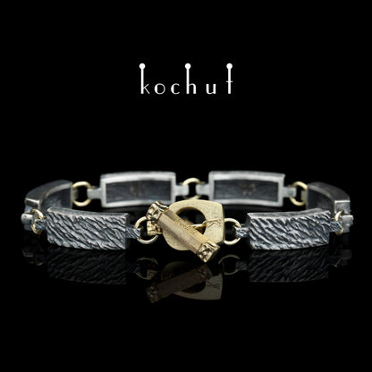 Wellen der Ruhe — Armband aus oxidiertem Silber und Gelbgold
