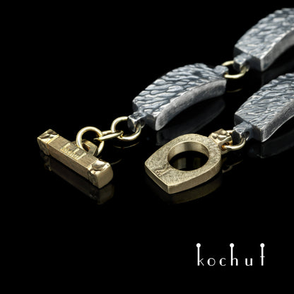 Wellen der Ruhe — Armband aus oxidiertem Silber und Gelbgold