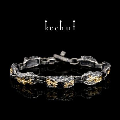 Kraft des Lebens — Armband aus oxidiertem Silber und Gelbgold mit Saphir
