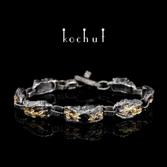 Kraft des Lebens — Armband aus oxidiertem Silber und Gelbgold mit Saphir