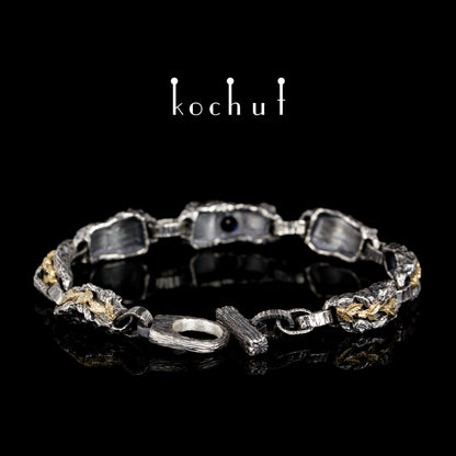 Kraft des Lebens — Armband aus oxidiertem Silber und Gelbgold mit Saphir