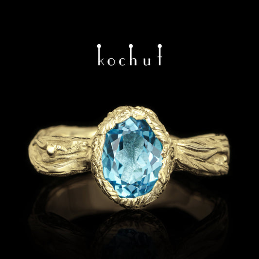 Quelle des Lebens — Ring aus Gelbgold mit einem Topas
