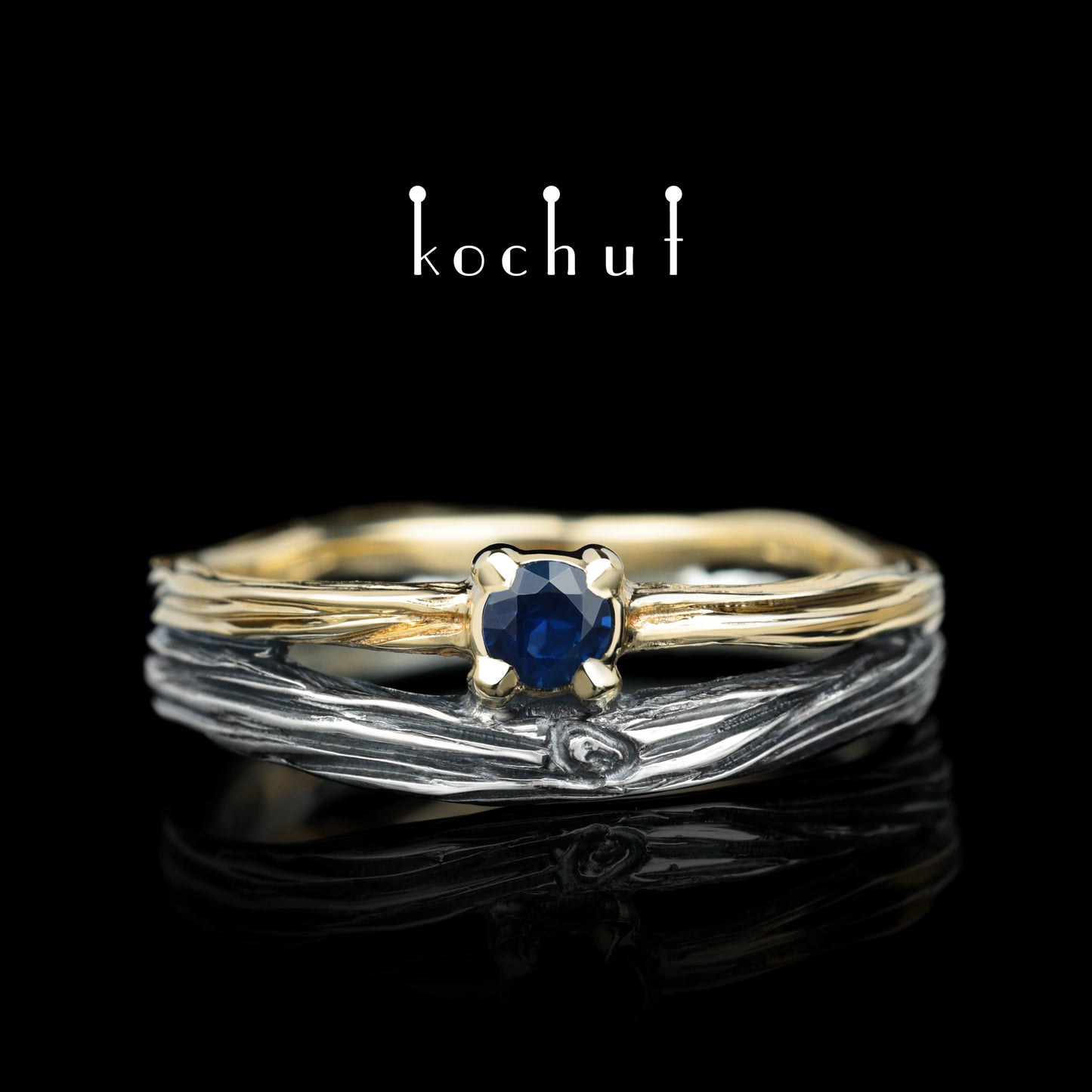 Auge des Waldes — Ehering aus oxidiertem Silber und Gelbgold mit Saphir