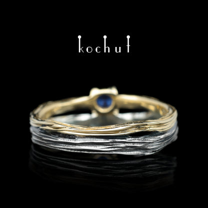 Auge des Waldes — Ehering aus oxidiertem Silber und Gelbgold mit Saphir