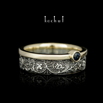 Harmonie der Natur — ein Ring aus Silber und Gelbgold, mit Saphir und Diamanten, beschichtet mit schwarzem Rhodium