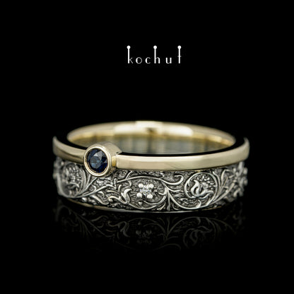 Harmonie der Natur — ein Ring aus Silber und Gelbgold, mit Saphir und Diamanten, beschichtet mit schwarzem Rhodium