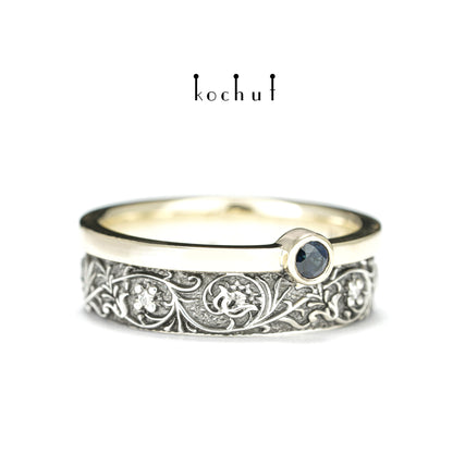 Harmonie der Natur — ein Ring aus Silber und Gelbgold, mit Saphir und Diamanten, beschichtet mit schwarzem Rhodium
