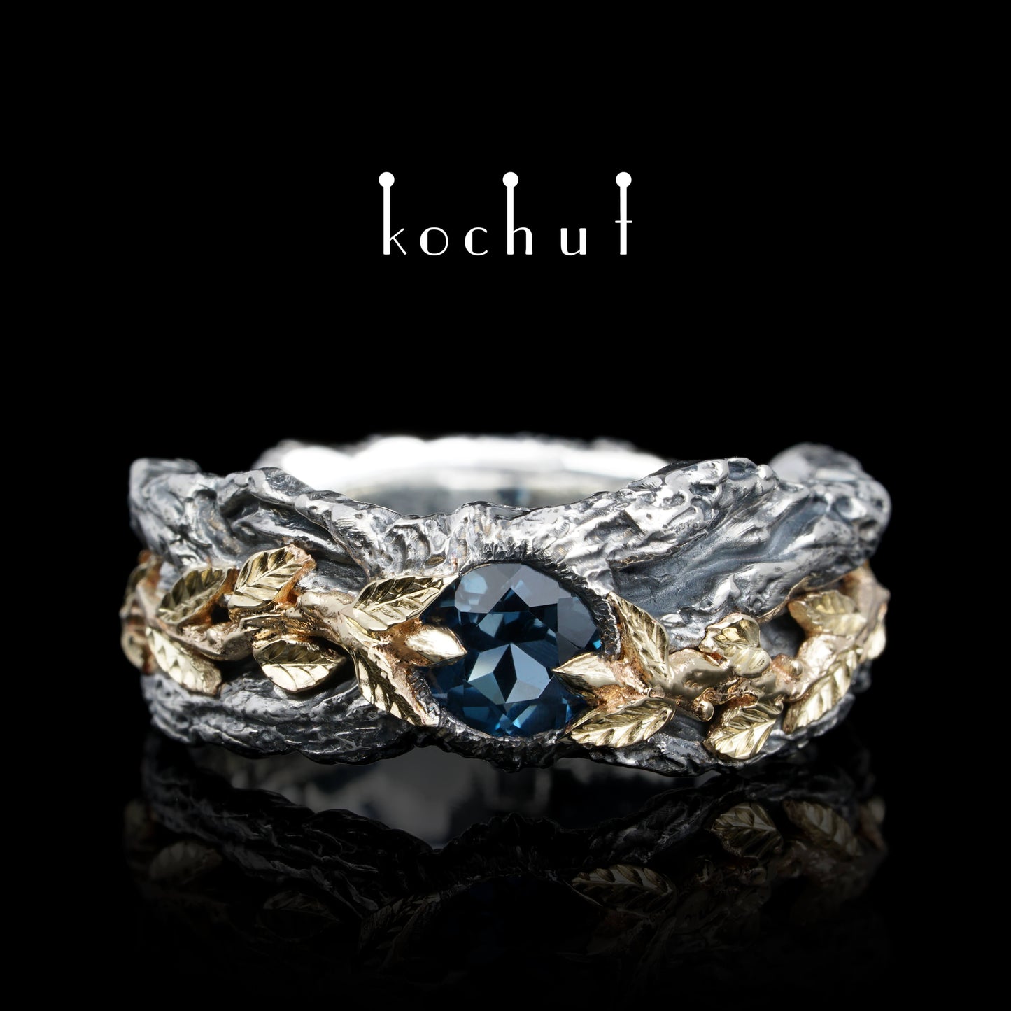 Kraft des Lebens — Ring aus oxidiertem Silber und Gelbgold mit Topas