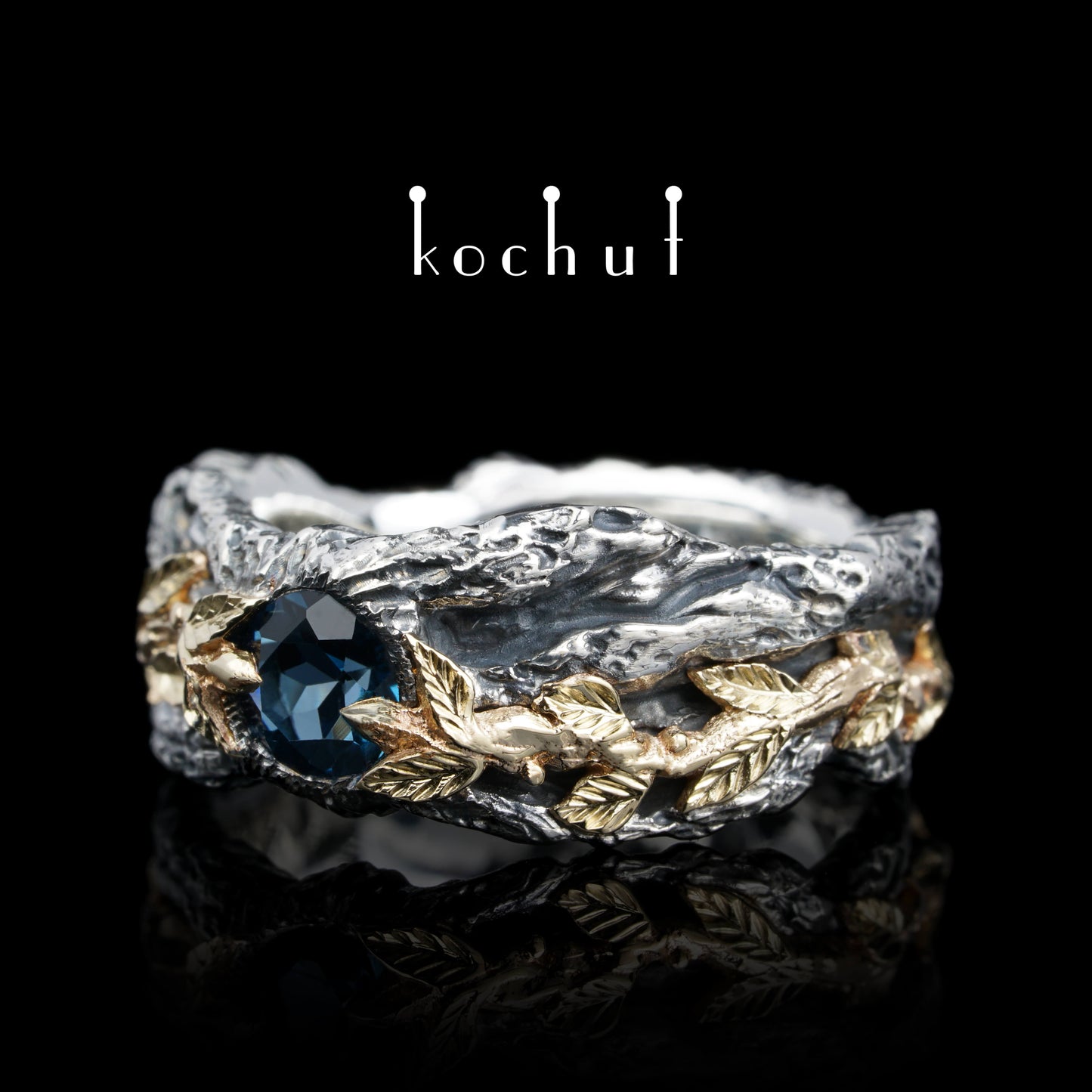 Kraft des Lebens — Ring aus oxidiertem Silber und Gelbgold mit Topas