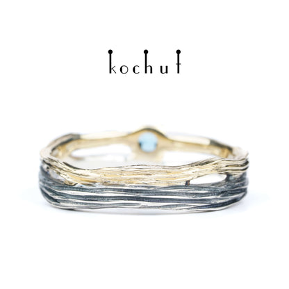 Auge des Waldes — ein Ehering aus oxidiertem Silber und Gelbgold mit Topas