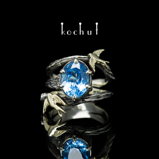 Schwalben — Ring aus Weiß- und Gelbgold mit einem Topas, überzogen mit schwarzem Rhodium