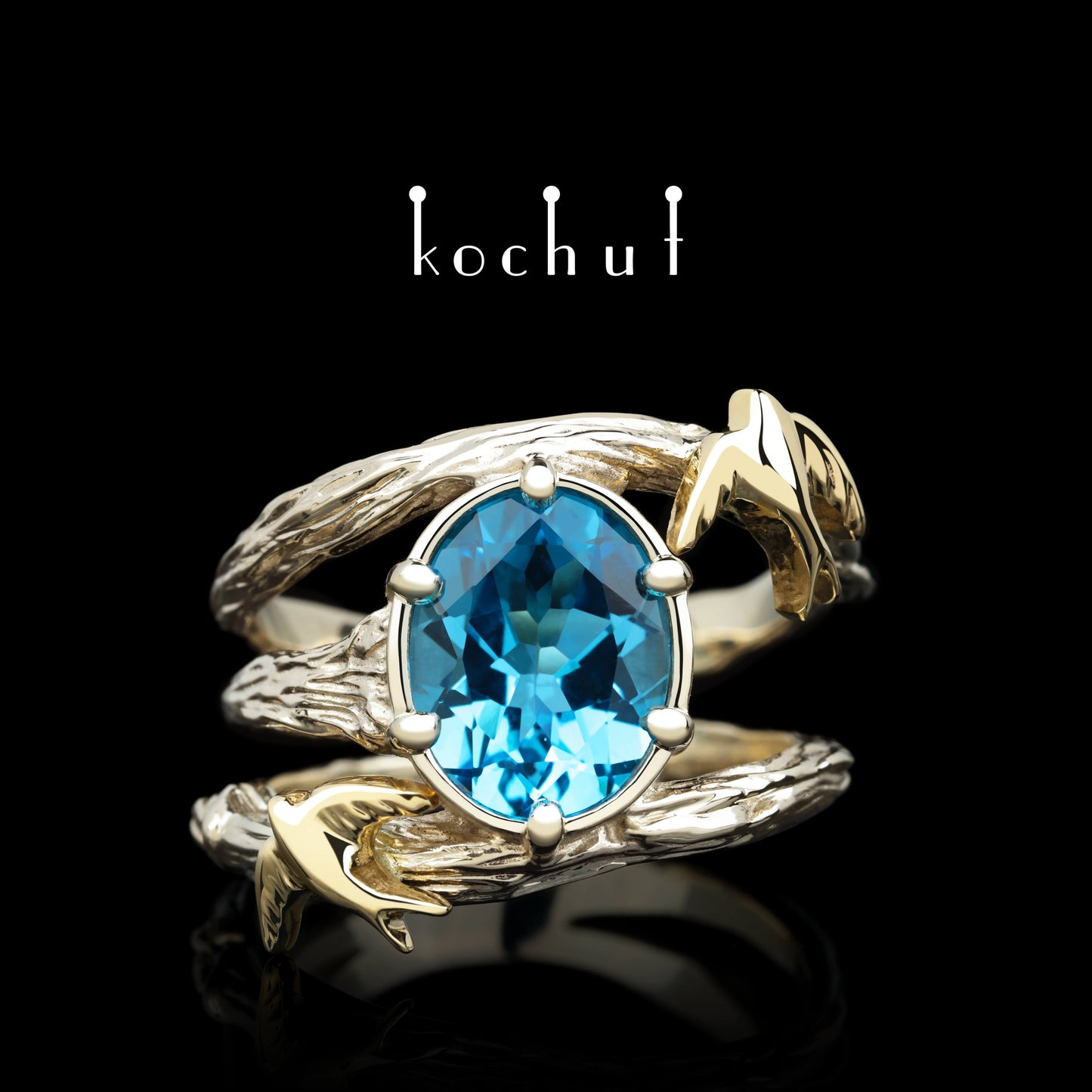 Schwalben — Ring aus Weiß- und Gelbgold mit Topas
