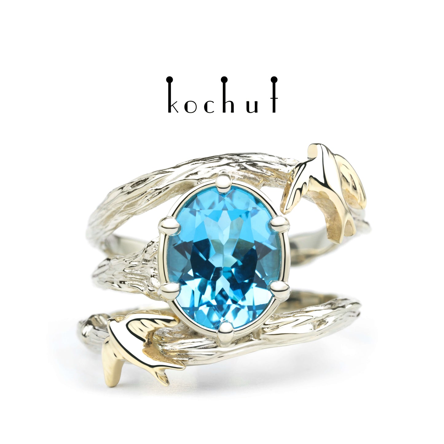 Schwalben — Ring aus Weiß- und Gelbgold mit Topas