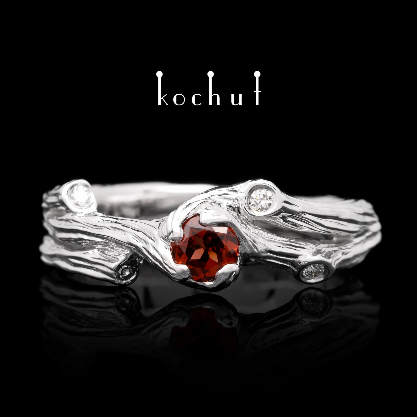 Zweig — Ring aus Weißgold mit Granat und Diamanten, rhodiniert.
