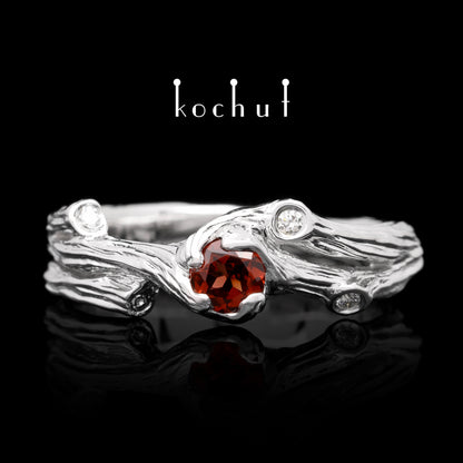 Zweig — Ring aus Weißgold mit Granat und Diamanten, rhodiniert.