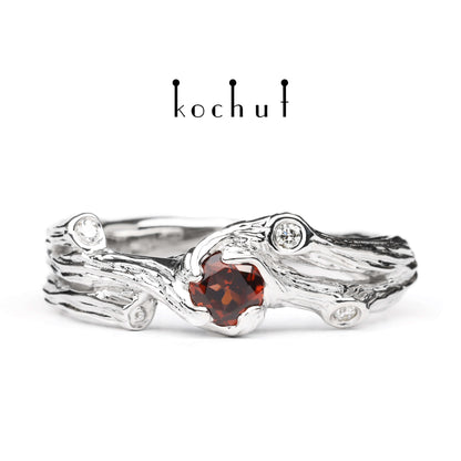 Zweig — Ring aus Weißgold mit Granat und Diamanten, rhodiniert.