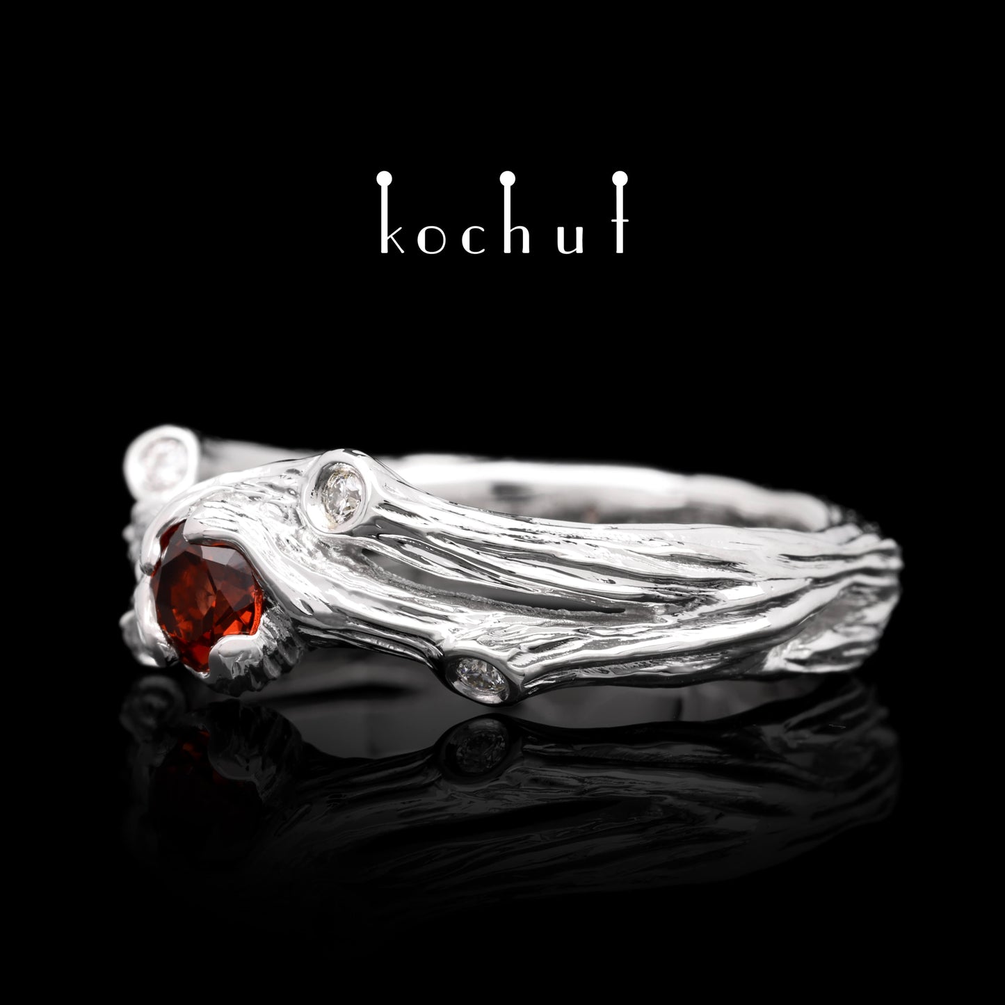 Zweig — Ring aus Weißgold mit Granat und Diamanten, rhodiniert.