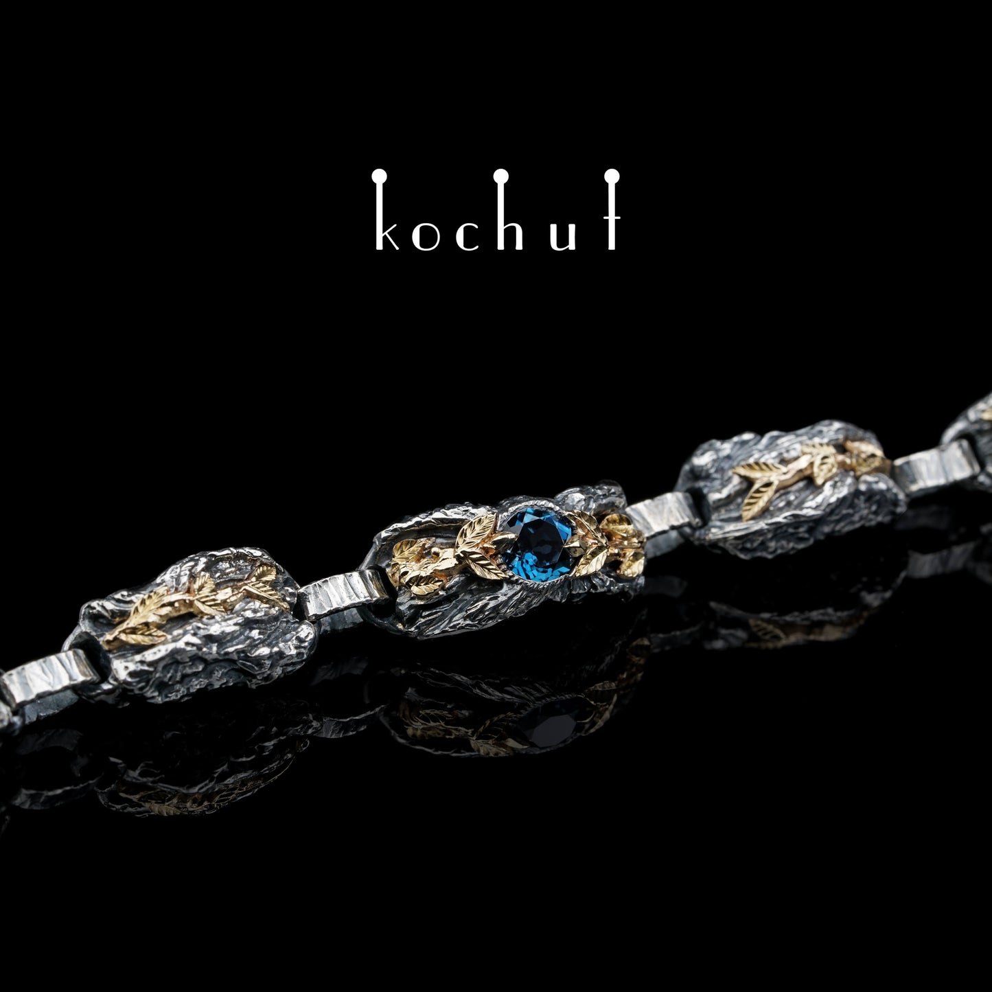 Kraft des Lebens — Armband aus oxidiertem Silber und Gelbgold mit Topas
